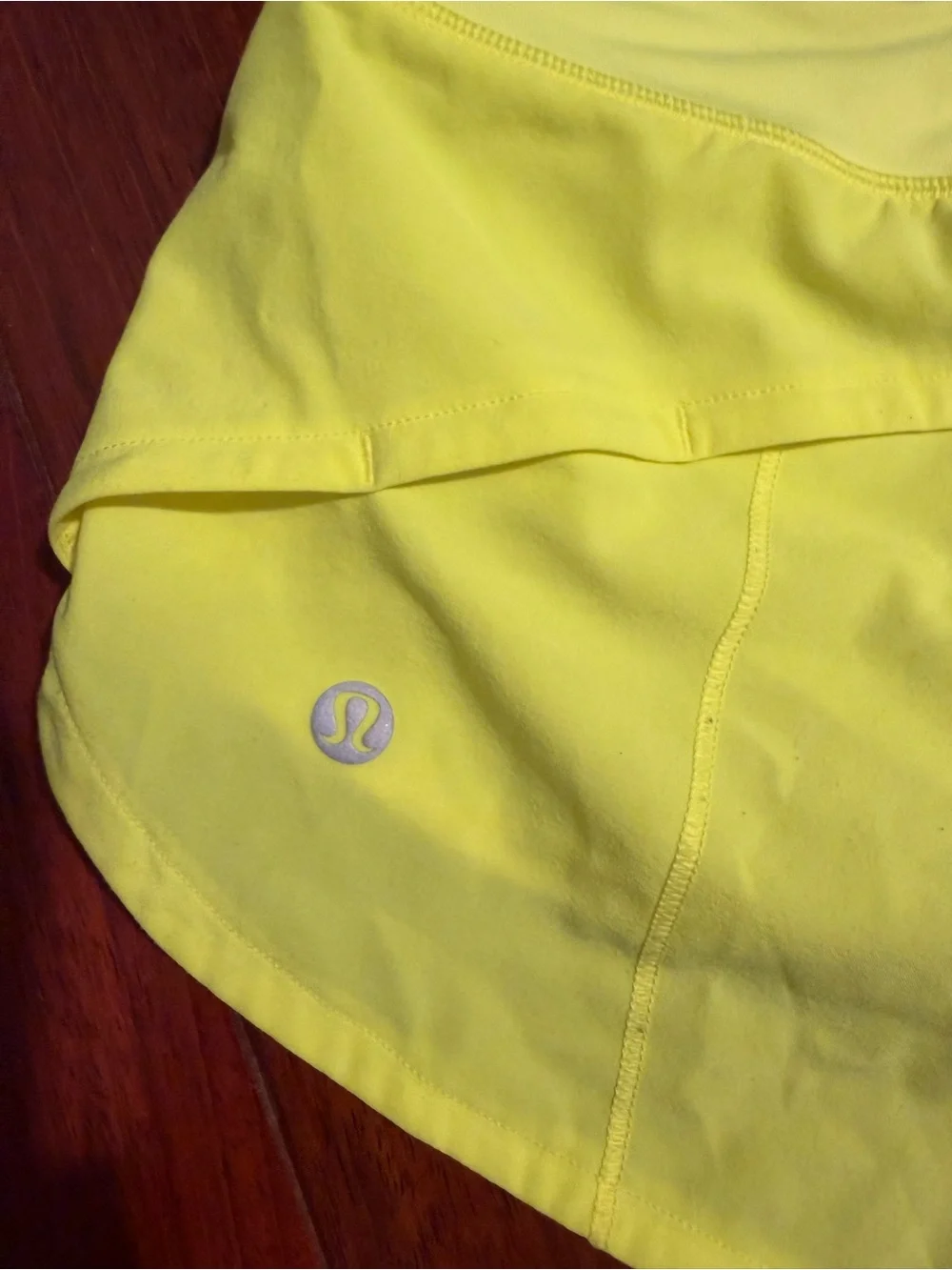 Women’s Lululemon  Highlight Yellow Speed Up Low-Rise Lined Shirts 2.5” - size 2